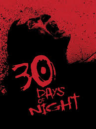 On a blood red background, a vicious vampire in black with long black hair bares their teeth. The text in red says, "30 Days of Night."