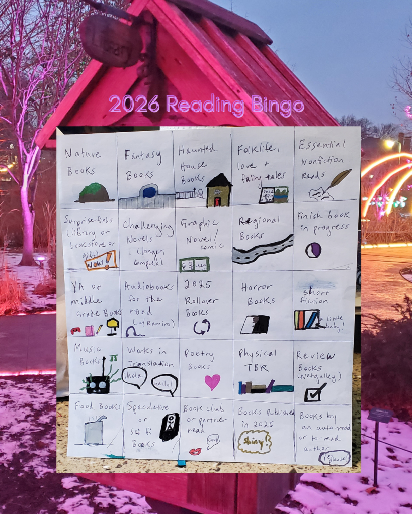 The background photo is a wooden little free library in a park at night lit by multicolored lights. At the forefront of is a photo of a reading bingo card with a variety genres and categories. In bold pink text at the top of the image it says 2026 Reading Bingo. 